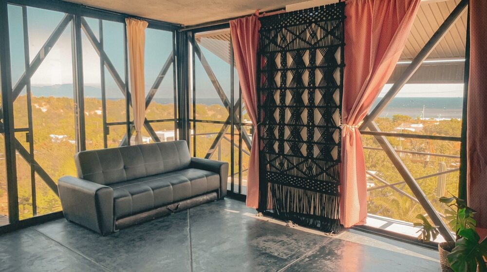 The yoga shala, a glass-walled room overlooking the bay